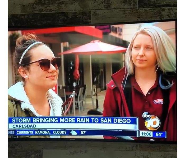 Two women that work for SERVPRO on the television.