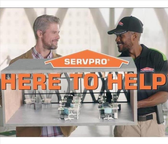 Here to help image of SERVPRO employee and customer